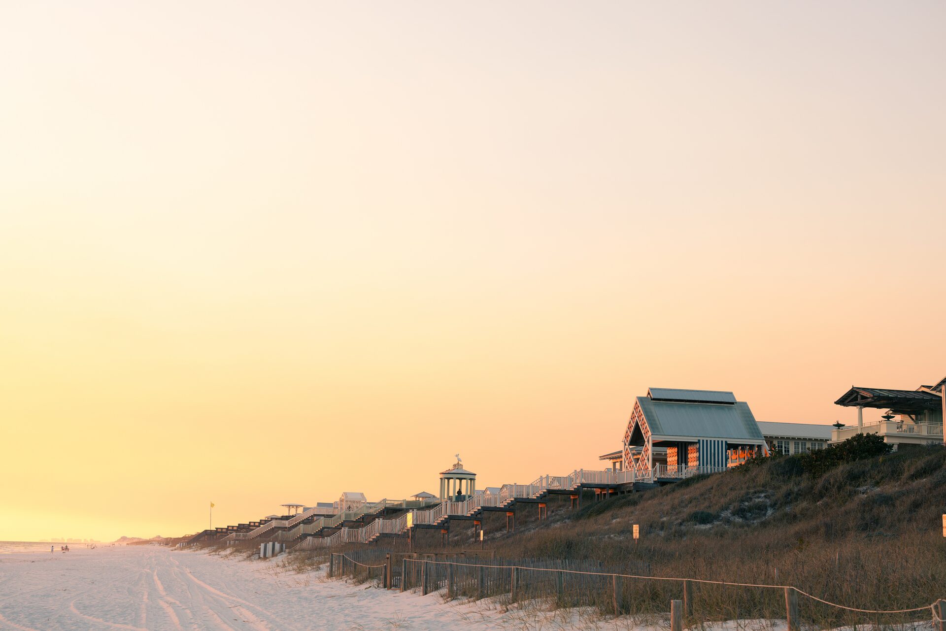 Golden-hour view of a 30A beach cottage along Florida's Emerald Coast